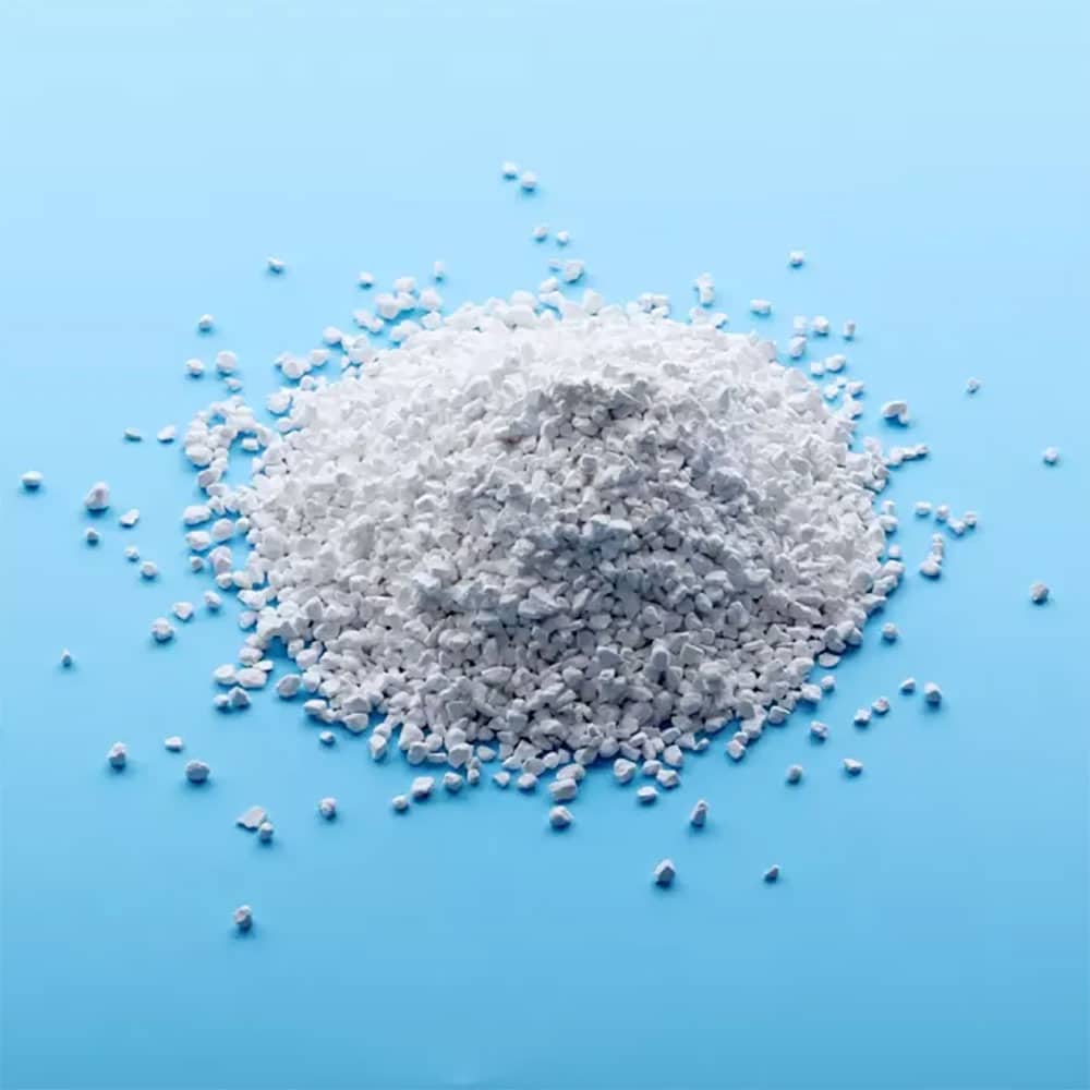 Potent Trichloroisocyanuric Acid Granules TCCA 90% for Superior Disinfection & Sanitation 1 Trichloroisocyanuric Acid Granules - A white granular chemical compound used for water treatment and disinfection.